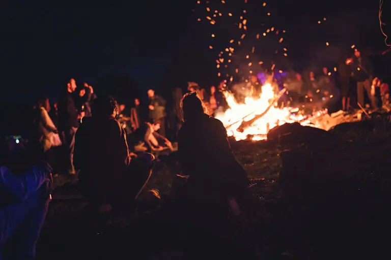 People sitting around a campfire